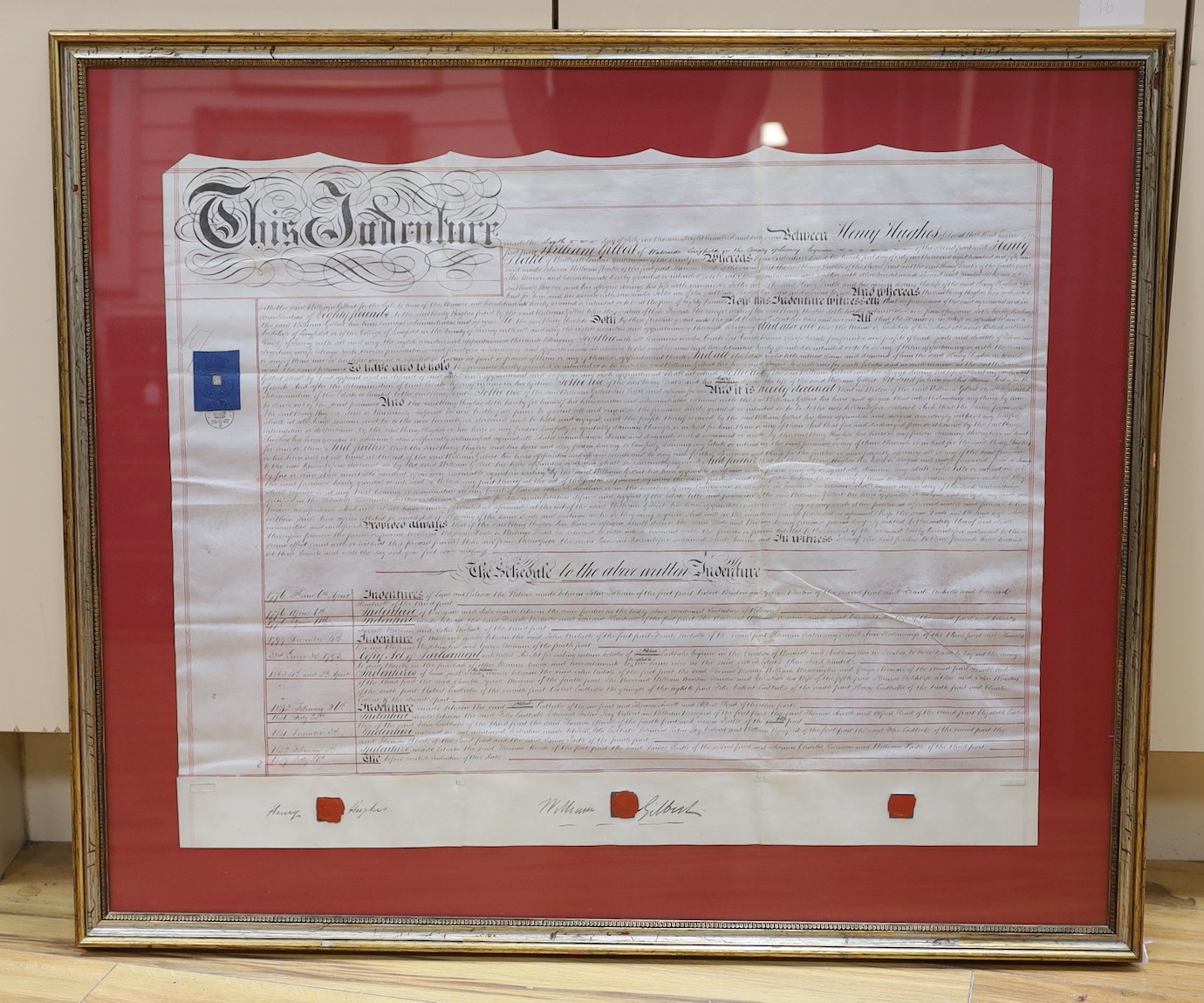 A framed 19th century indenture, for Henry Gilbert of Lingfield, 71 cms wide x 57 cms high.